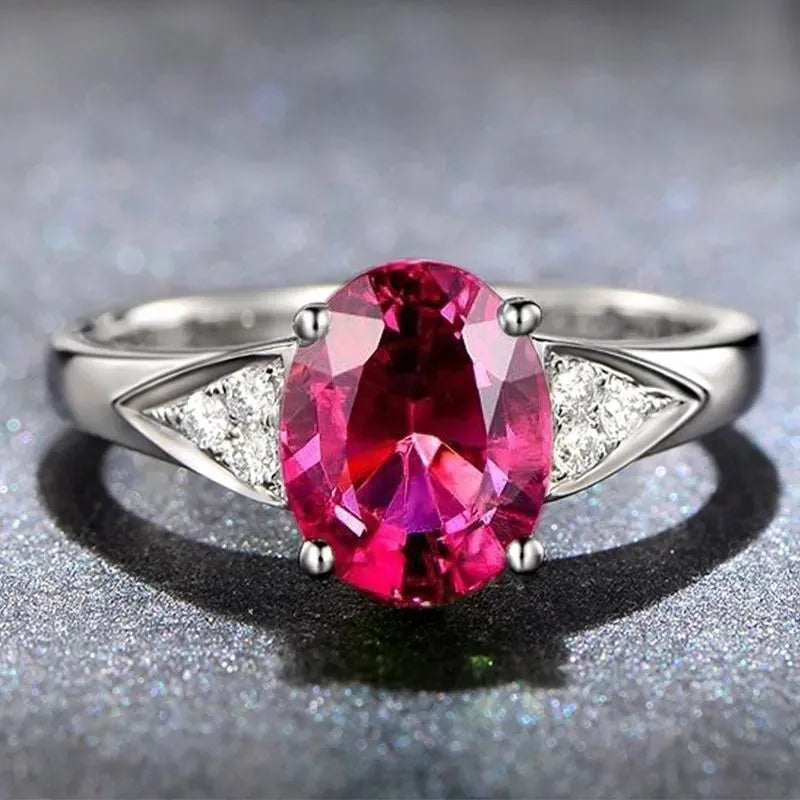 Women's ring with a choice of heart, water drop, or bell pattern in natural zircon, on a model's hand.