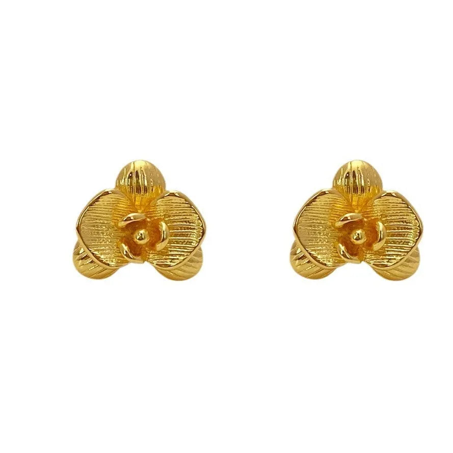 Retro flower earrings for women in gold and silver colours with petal detail