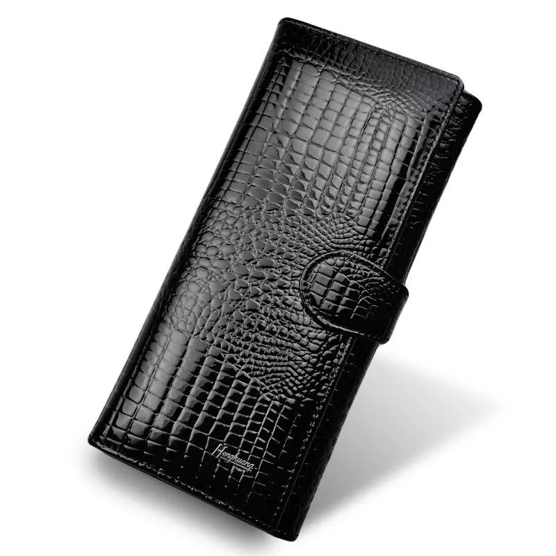 Women's red patent leather coin purse with embossed crocodile pattern texture.
