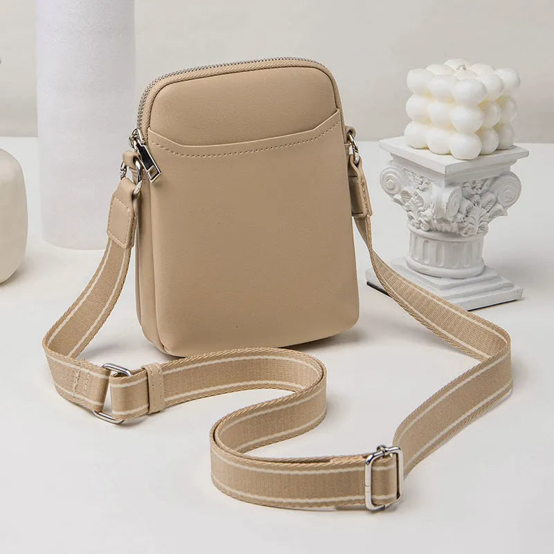 Solid colour PU leather mobile phone crossbody shoulder bag shown in beige.
