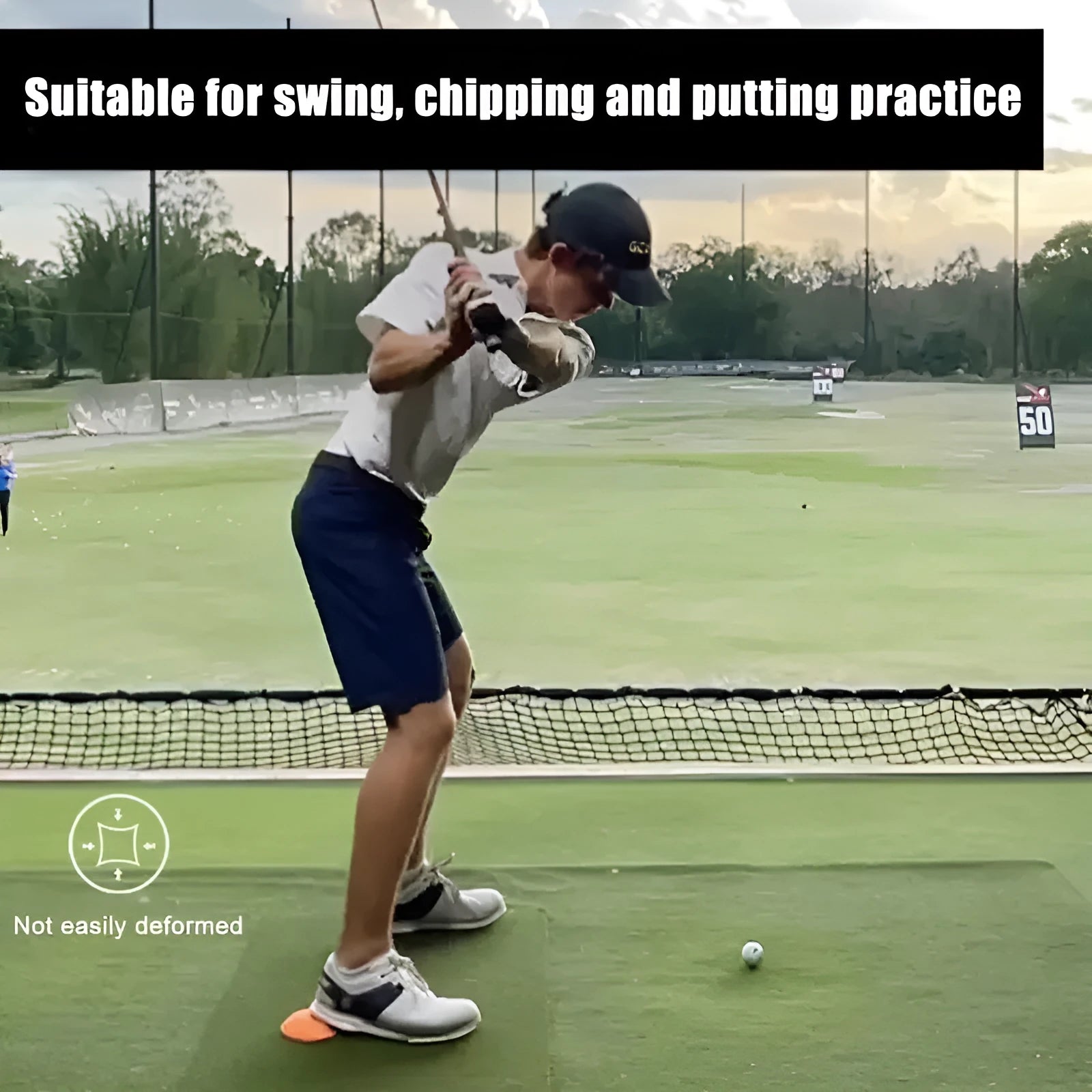 Orange natural rubber golf training mat with centre of gravity zone for swing practice
