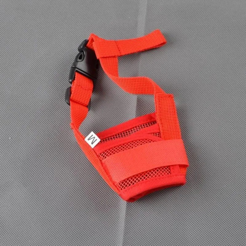 Adjustable plastic dog safety muzzle in black, shown on a size chart.