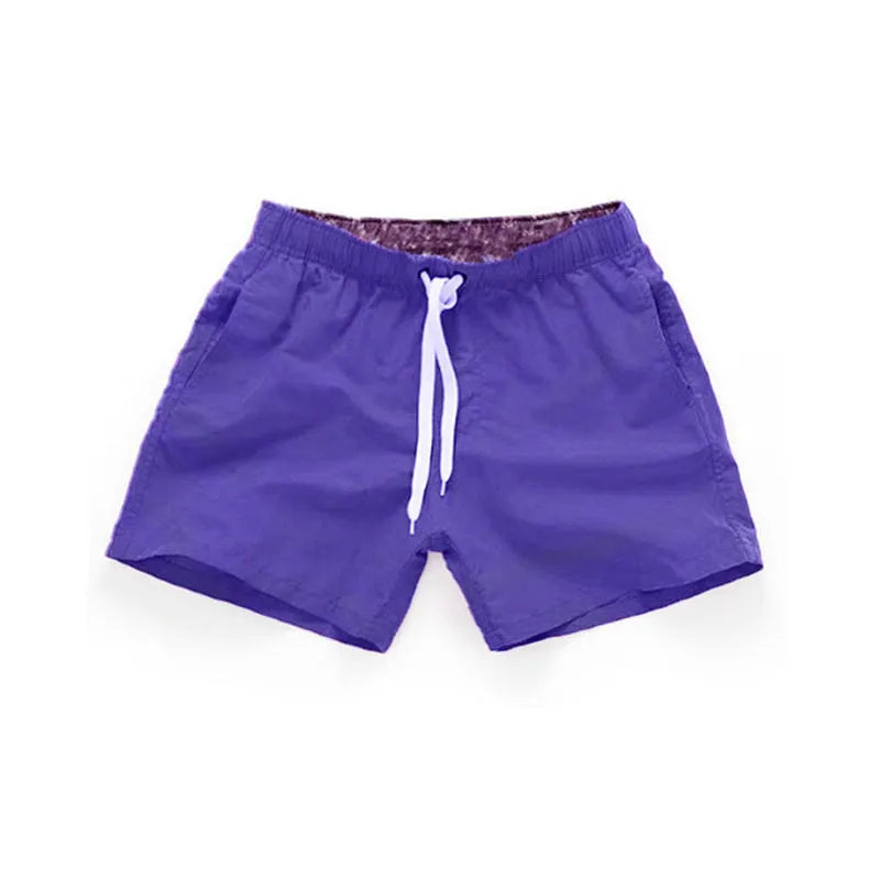 Men's straight leg polyester board shorts on a hanger, available in multiple colours and plus sizes.