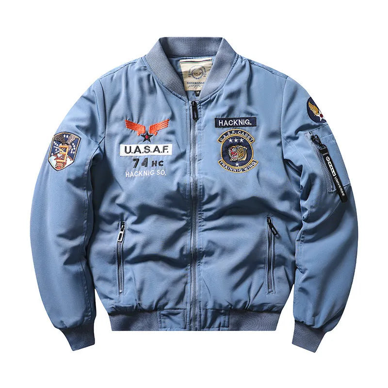 Man wearing a slim-fit blue retro embroidered stand collar cotton-padded coat with patch pockets.