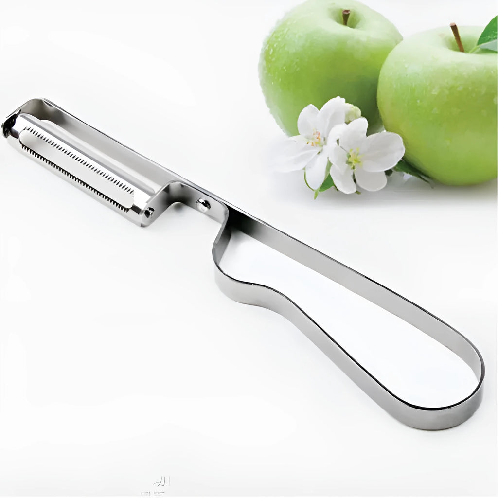 Silver stainless steel fruit and vegetable peeler on a clean kitchen counter