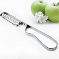Silver stainless steel fruit and vegetable peeler on a clean kitchen counter