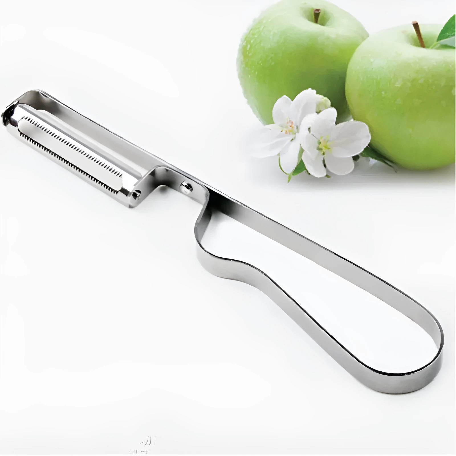 Silver stainless steel fruit and vegetable peeler on a clean kitchen counter