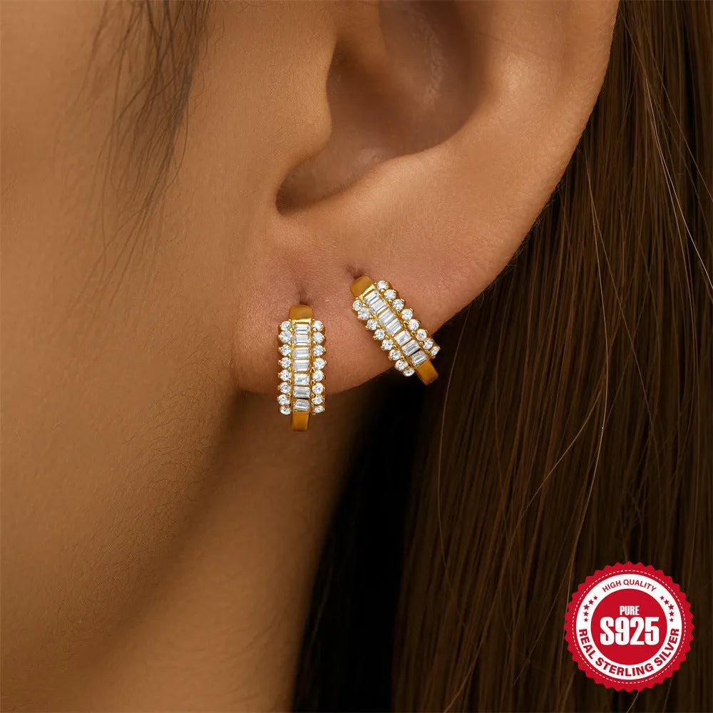 Sterling silver geometric stud earrings with round diamond accents in gold and silver electroplated finishes