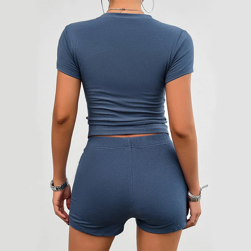 Women's solid colour slim fit sports suit two-piece set with t-shirt and shorts.