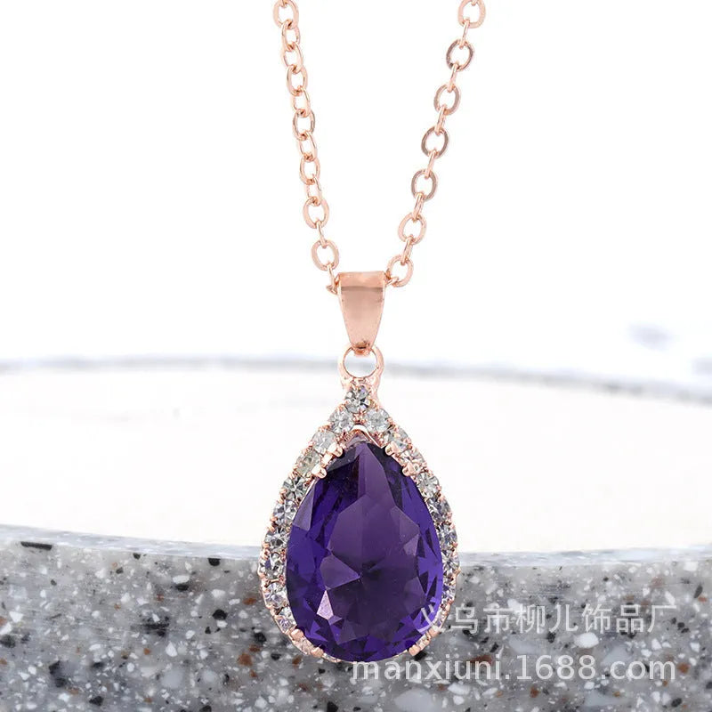 Rose gold geometric drop necklace with rhinestone details in pink colour option
