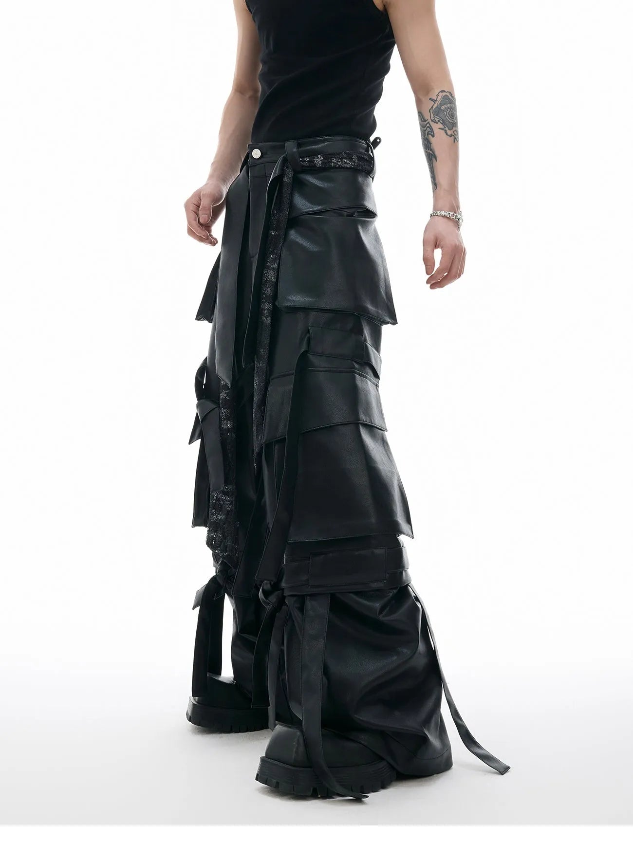 Black quilted leather trousers with multiple pockets and retro stitching details