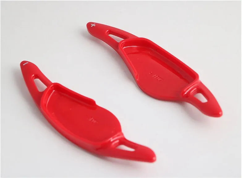 Carbon fibre pattern steering wheel paddle shifters in black and red finishes