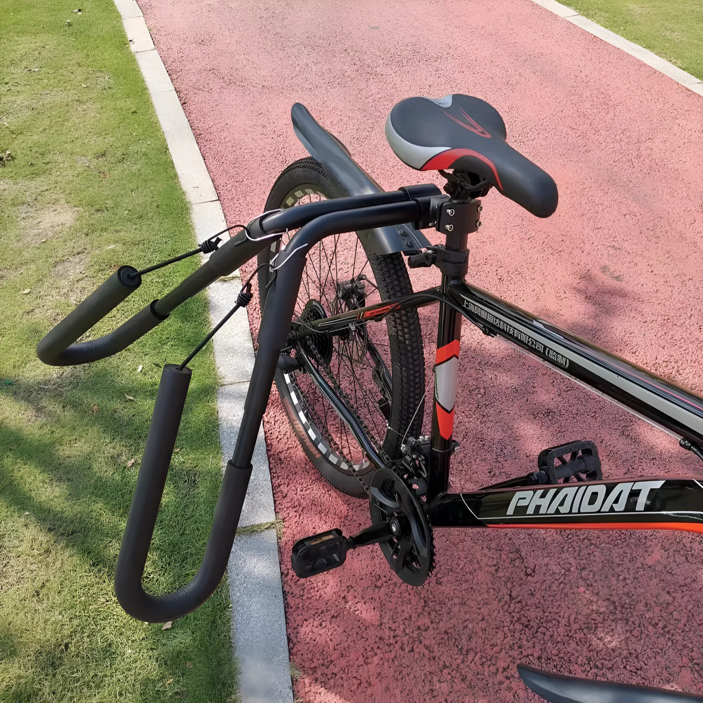 Black aluminium bicycle surfboard hanger bracket on a bike with surfboard attached