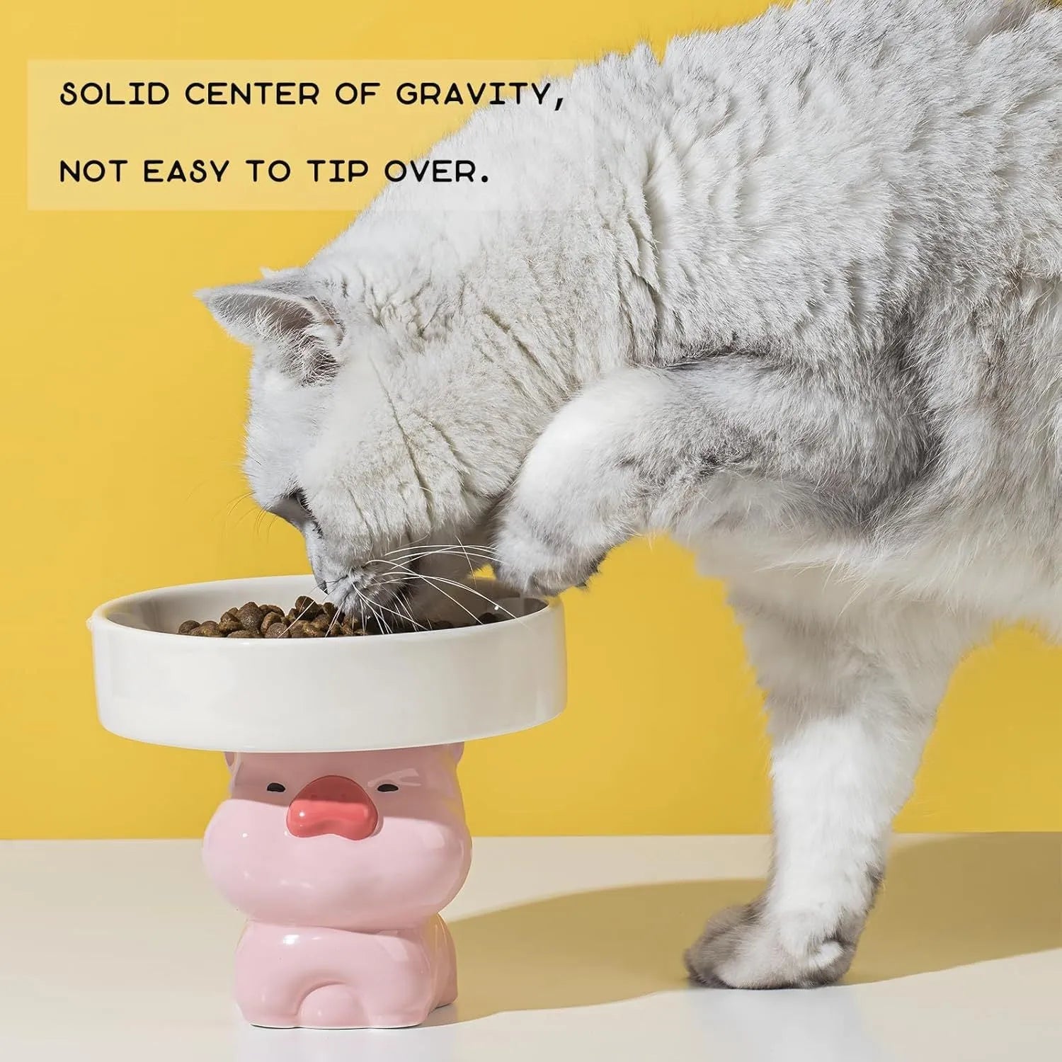 Ceramic raised cat bowl in animal theme design on a floor