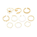 Openwork floral ring in glossy gold electroplated alloy metal