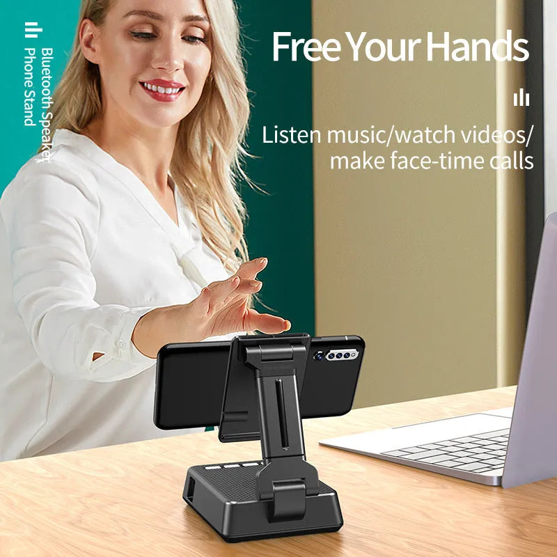Black mobile phone broadcasting stand with integrated Bluetooth speaker and microphone on desk