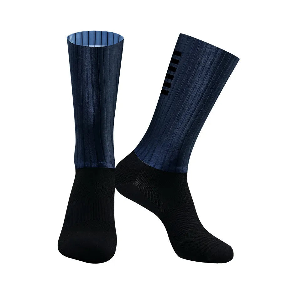 Cycling socks in chemical fibre blend fabric shown in orange, black, purple, white, grey and dark blue colour options