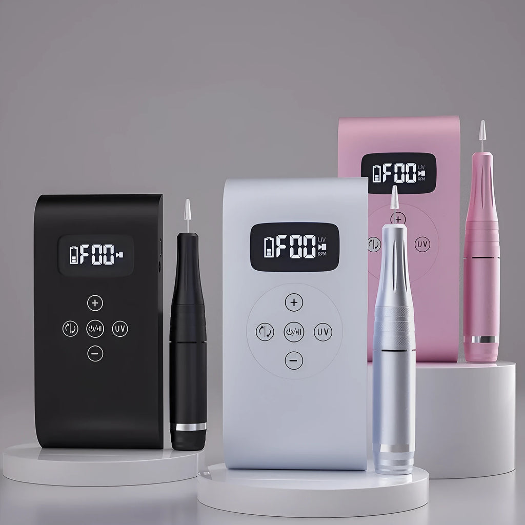 Silver battery nail polisher with stainless steel body, UV lamp, and six nail bits on a white background