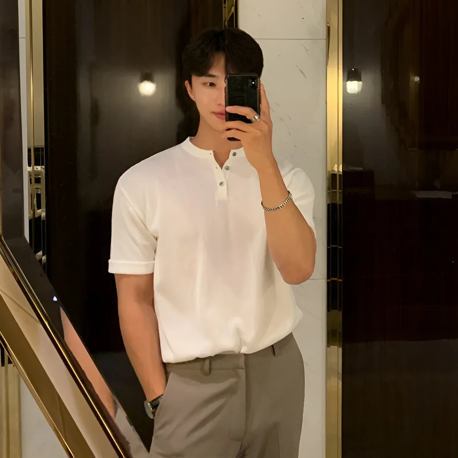 Men's slim-fit black short-sleeved knitted shirt made from thin ice silk material.