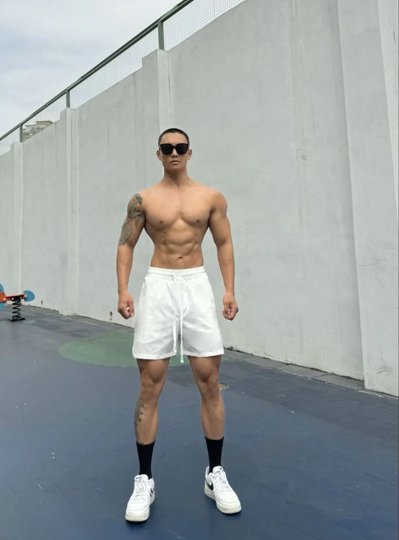 Men's black quick-drying nylon ice silk shorts with double-layer quarter-length design