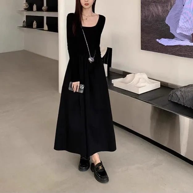 Women's black knitted dress with square collar, long sleeves, elastic waist, and A-line floor-length skirt