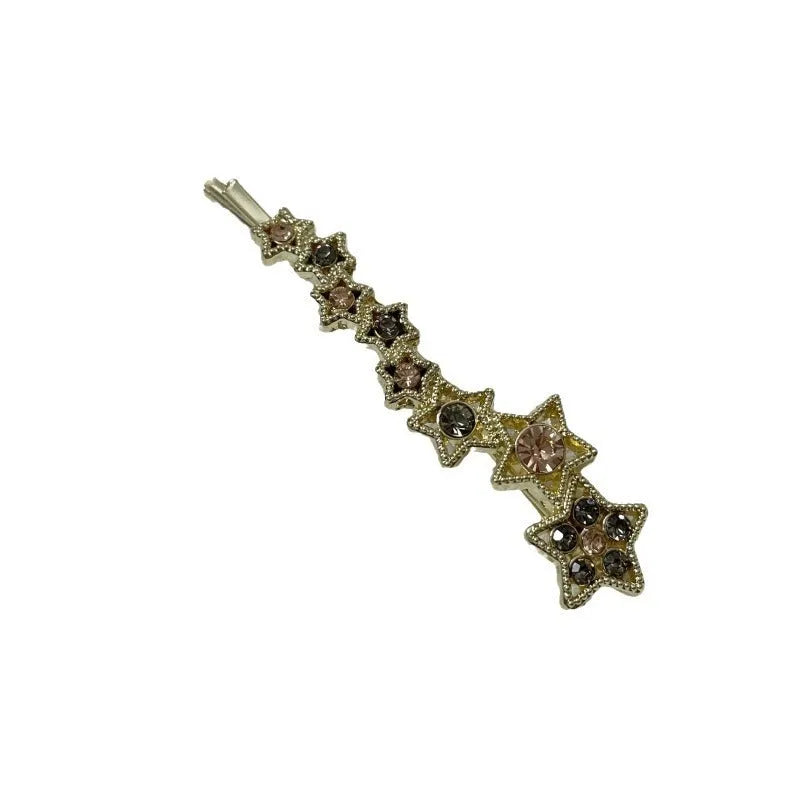 Gold-coloured alloy hair barrette with five-pointed star decoration and side-clip mechanism