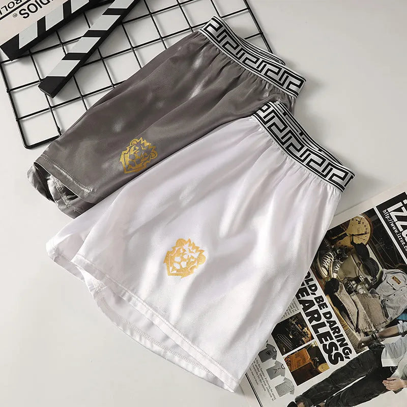 Men's solid colour knitted polyester boxer shorts in black, loose fit mid-waist breathable design, available in sizes L to 4XL