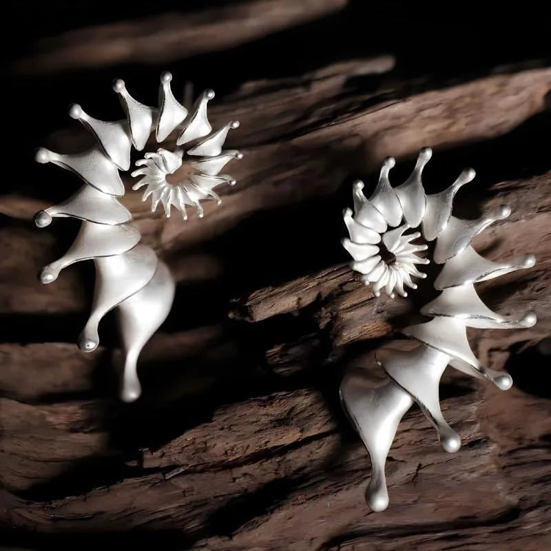 Conch colour stud earrings with three-dimensional matte finish and irregular contemporary design