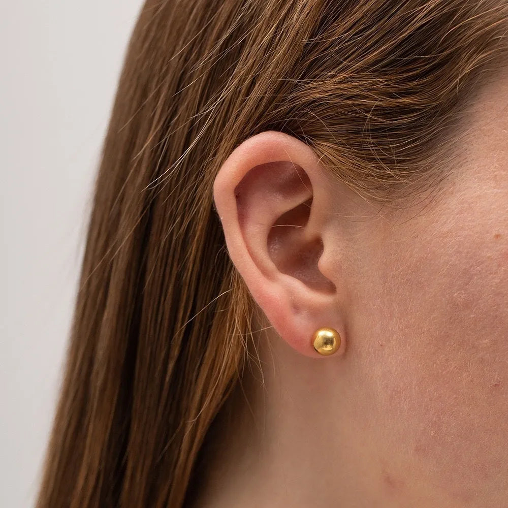 Titanium steel ball stud earrings in gold or silver finish, available in 3mm to 6mm sizes