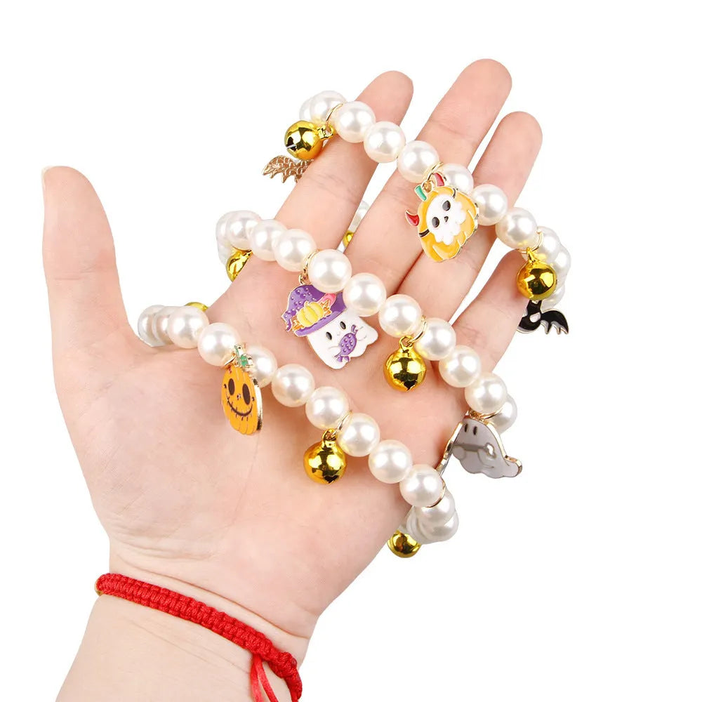 Halloween pearl necklace pet collar with pumpkin designs in purple ghost, skull, and smiling variations