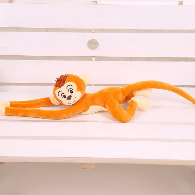 Soft plush monkey toy with long arms hanging from a curtain rod, available in 70cm and 90cm sizes and four colours