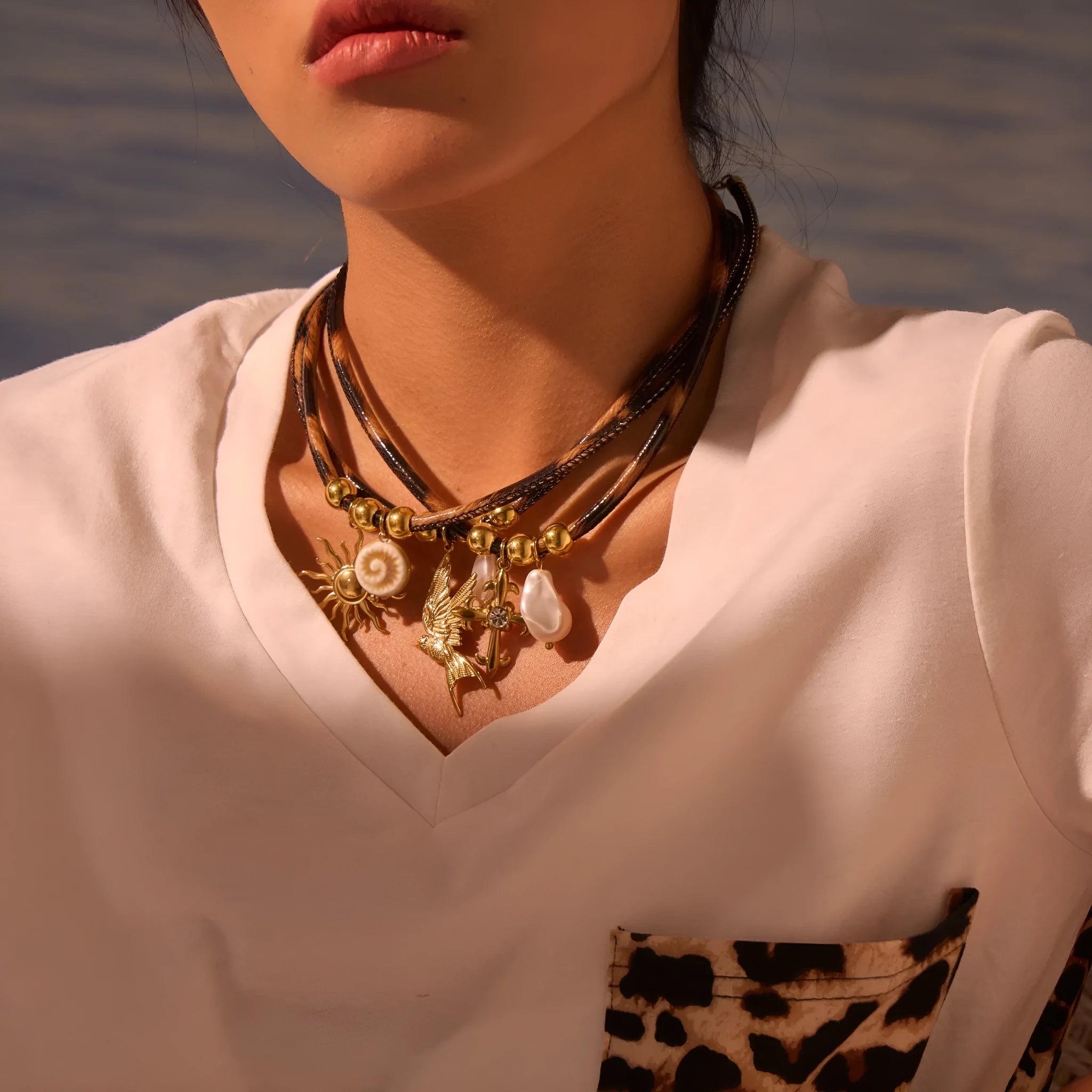 Women's stainless steel necklace with leopard print geometric pendant and gold electroplated finish