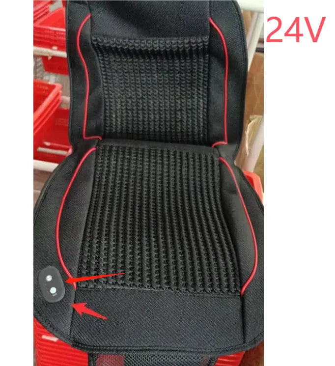 Square black car ventilation seat cushion on a car seat with a connected power cord.