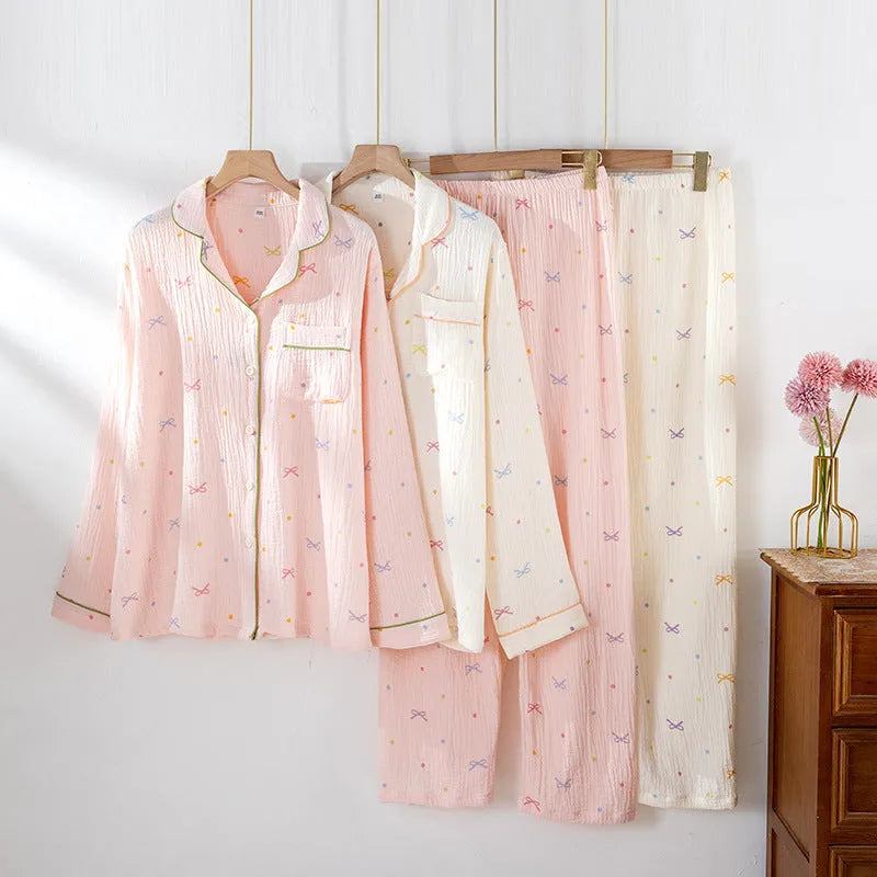 Women's beige thin cotton long-sleeved pajama top and trousers set laid flat