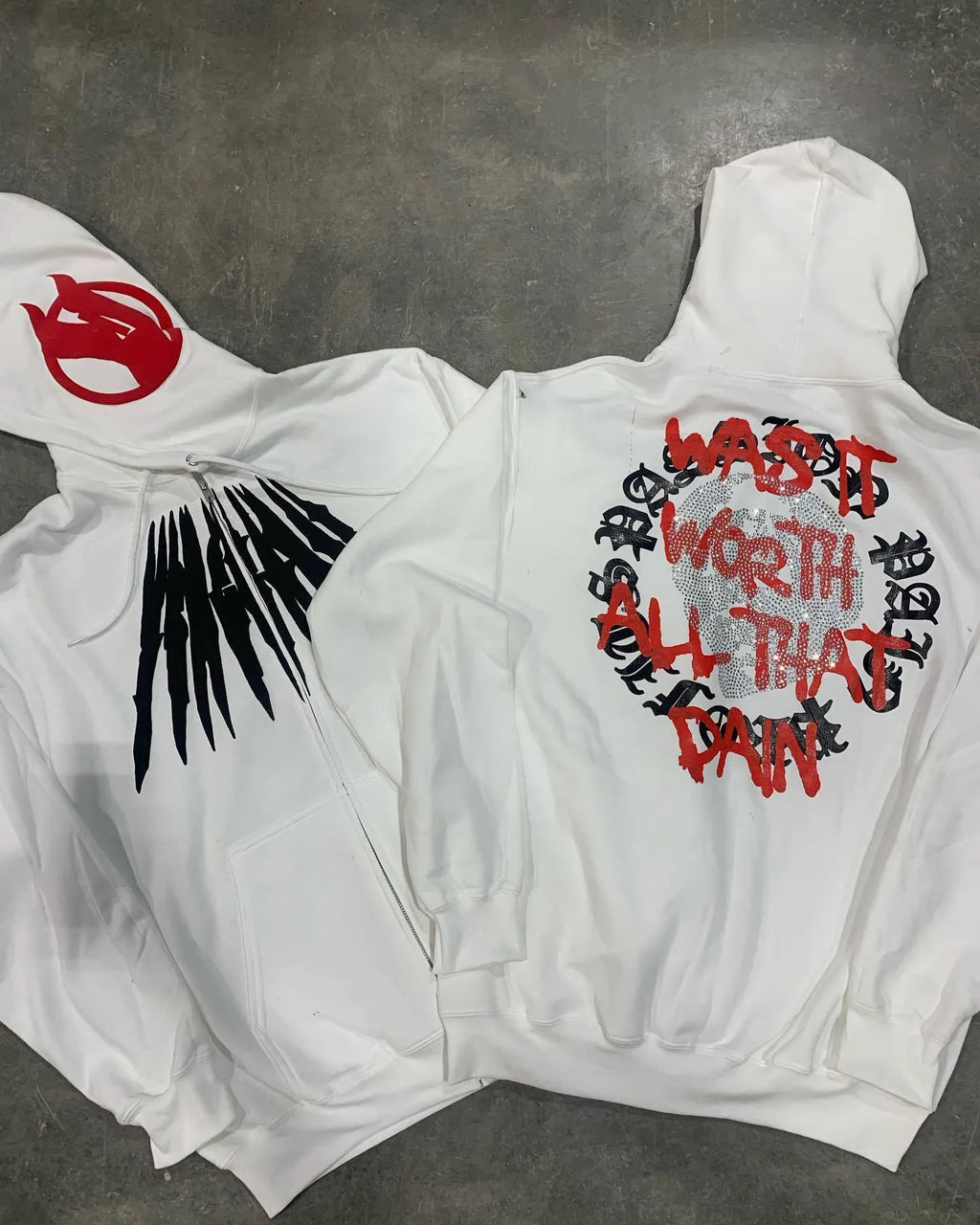 Black hooded sweatshirt cardigan with printed skull pattern and rhinestone detailing