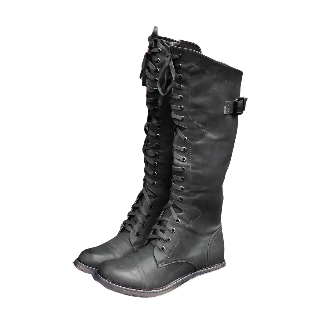 Women's black knight ankle boots with a cross-strap design, made from artificial PU leather.