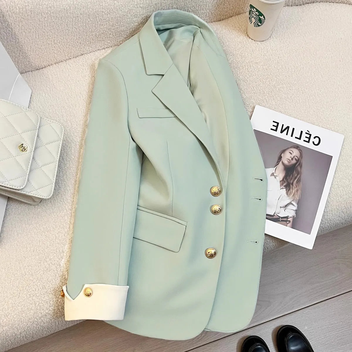 Korean-style loose-fit women's coat in beige and black, showing long sleeves and pockets.