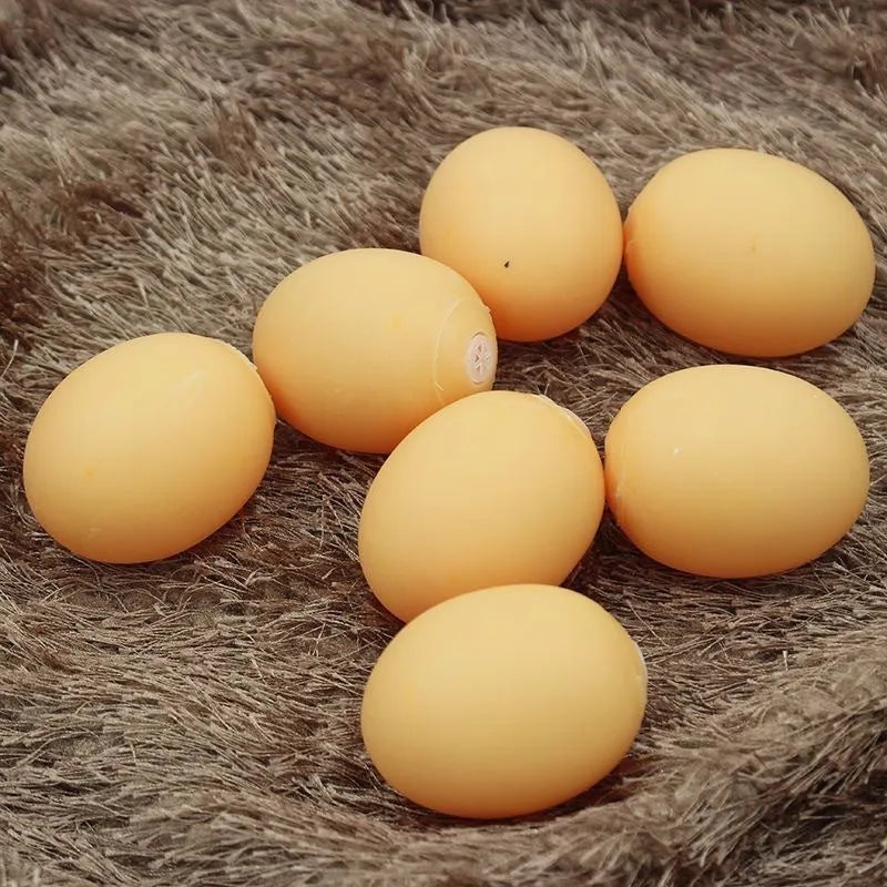 Chicken-flavoured simulation egg dog toy with textured surface for dental cleaning