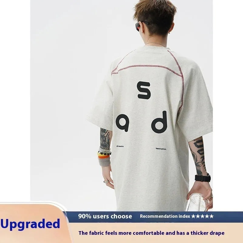 Cotton short-sleeve t-shirt with letter print design in loose fit showing round neck collar