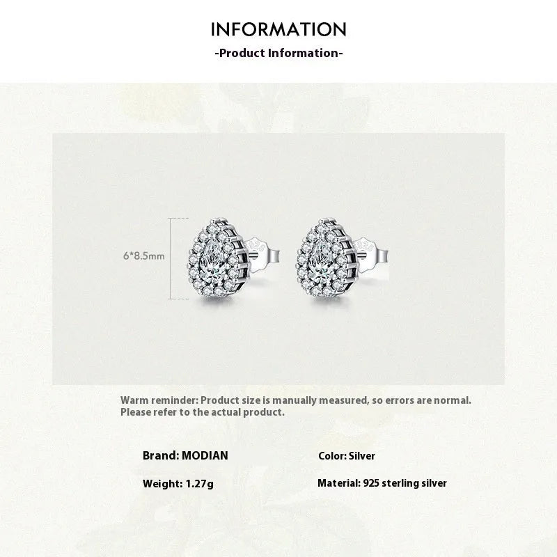 A pair of silver drop shape ear studs for women with a diamond-treated finish.