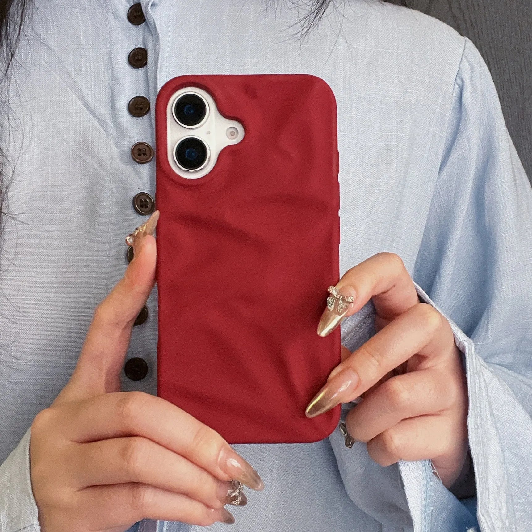 High-grade three-dimensional pleated pattern silicone phone case for iPhone 17 series in black, soft shell construction with fall protection