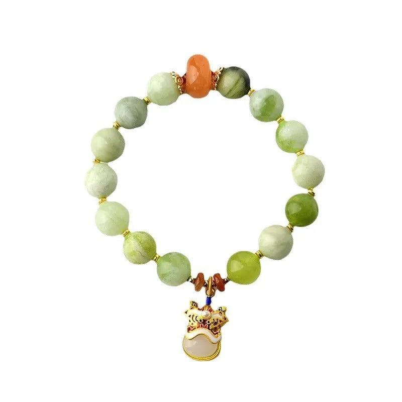 Green milk-in-water Xingshi jade geometric pendant on an adjustable string bracelet