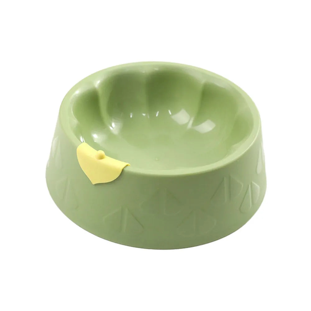Green plastic double pet bowl feeder for dogs and cats on a white background