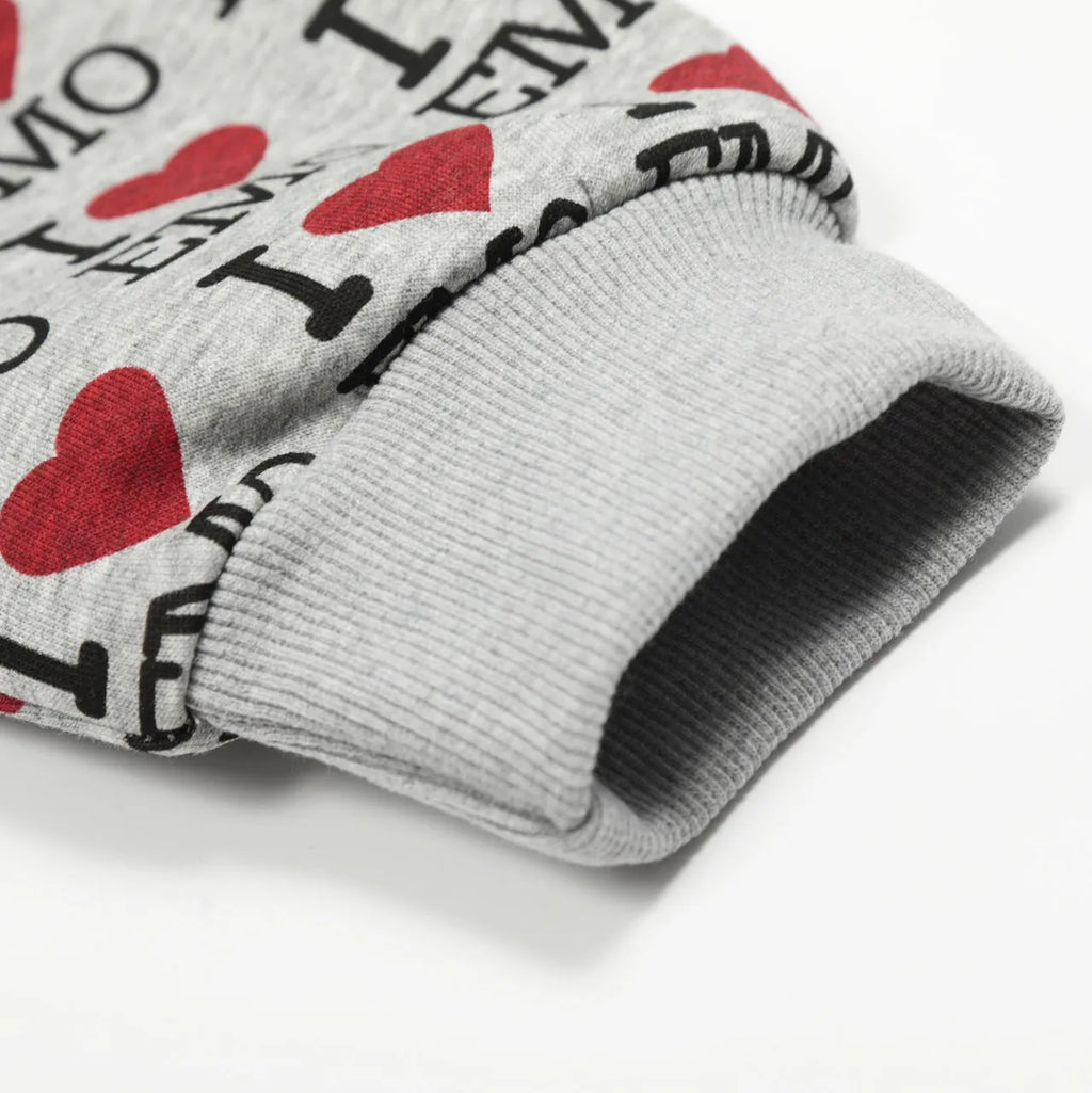 Women's melange grey cotton hooded cardigan with retro pattern showing long sleeves and street fashion styling