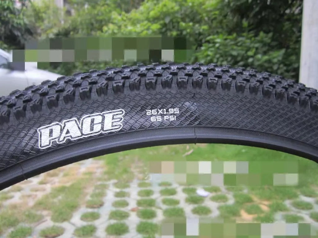 Ultralight puncture-proof mountain bike tyre shown in black with white label sidewall option.