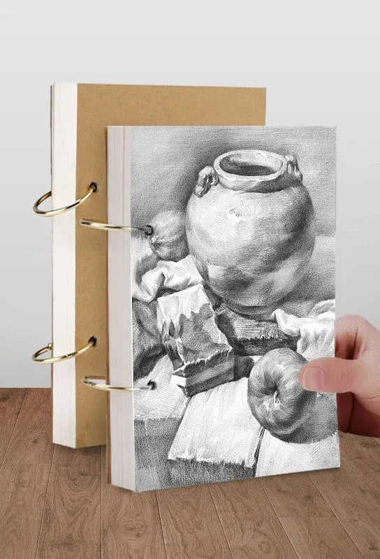 Thickened 8K sketchbook with 70 sheets, detachable coil binding, open to a marker drawing on white paper