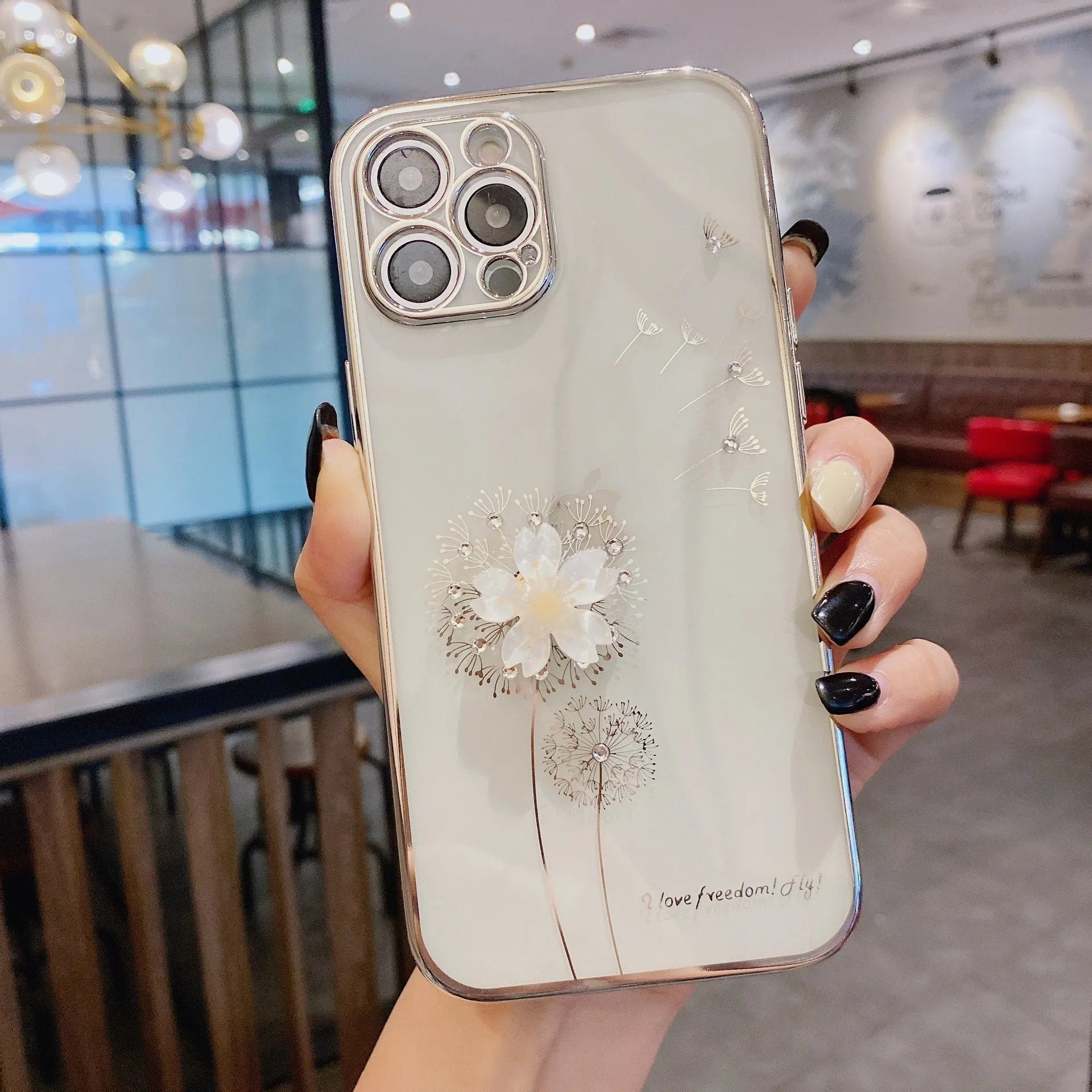 Green 3D floral patterned iPhone case with a silver rotating ring stand on the back.