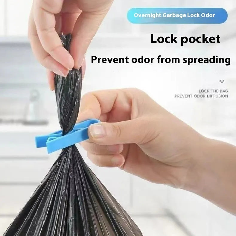 White PP plastic side-fixed clip for holding a bin bag on a trash can rim.