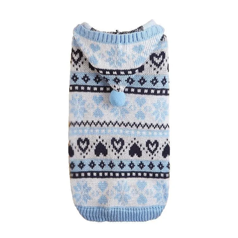 Blue striped camouflage dog sweater with snowflake and heart pattern on small white dog