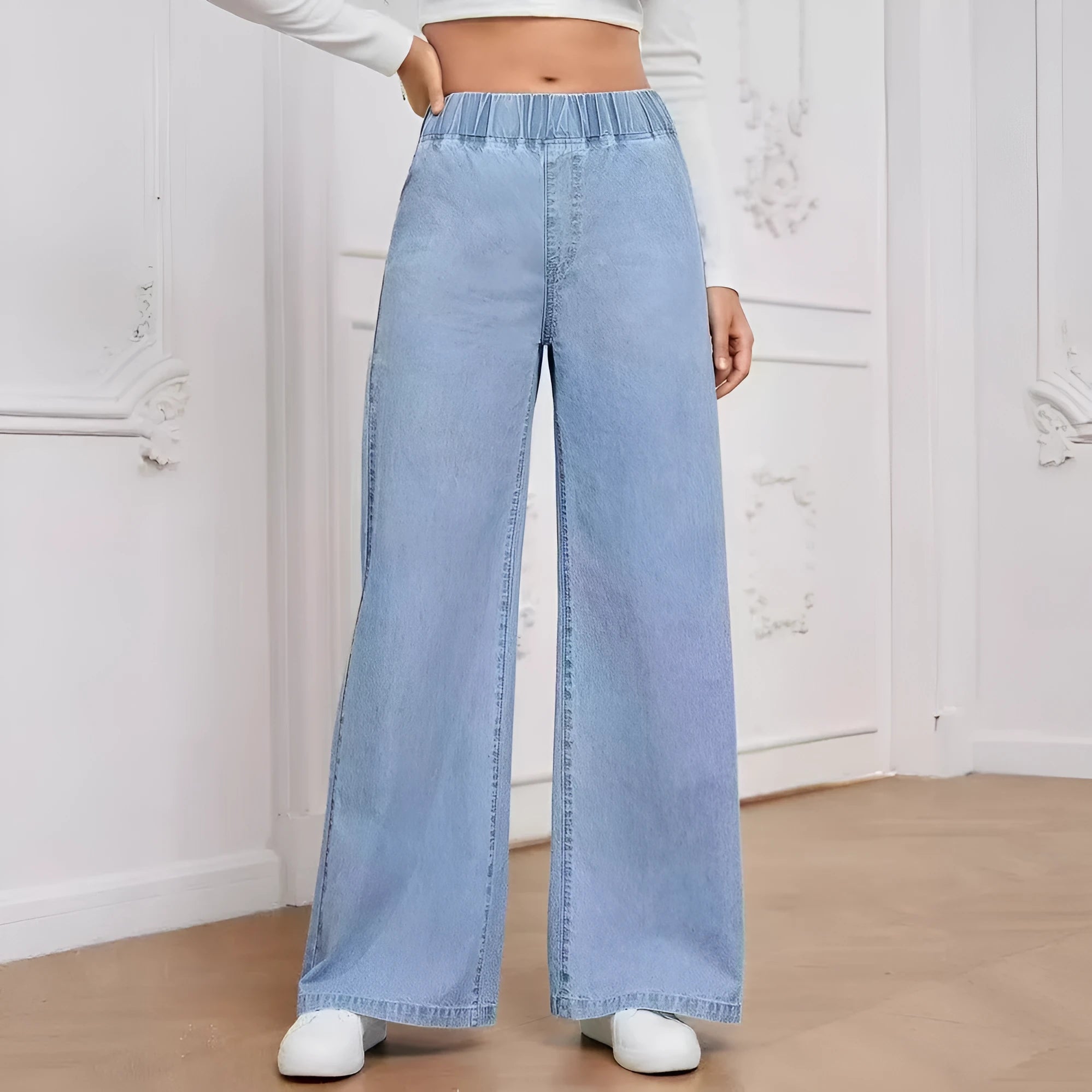 Plus size light blue wash wide leg jeans with straight fit and zip fly